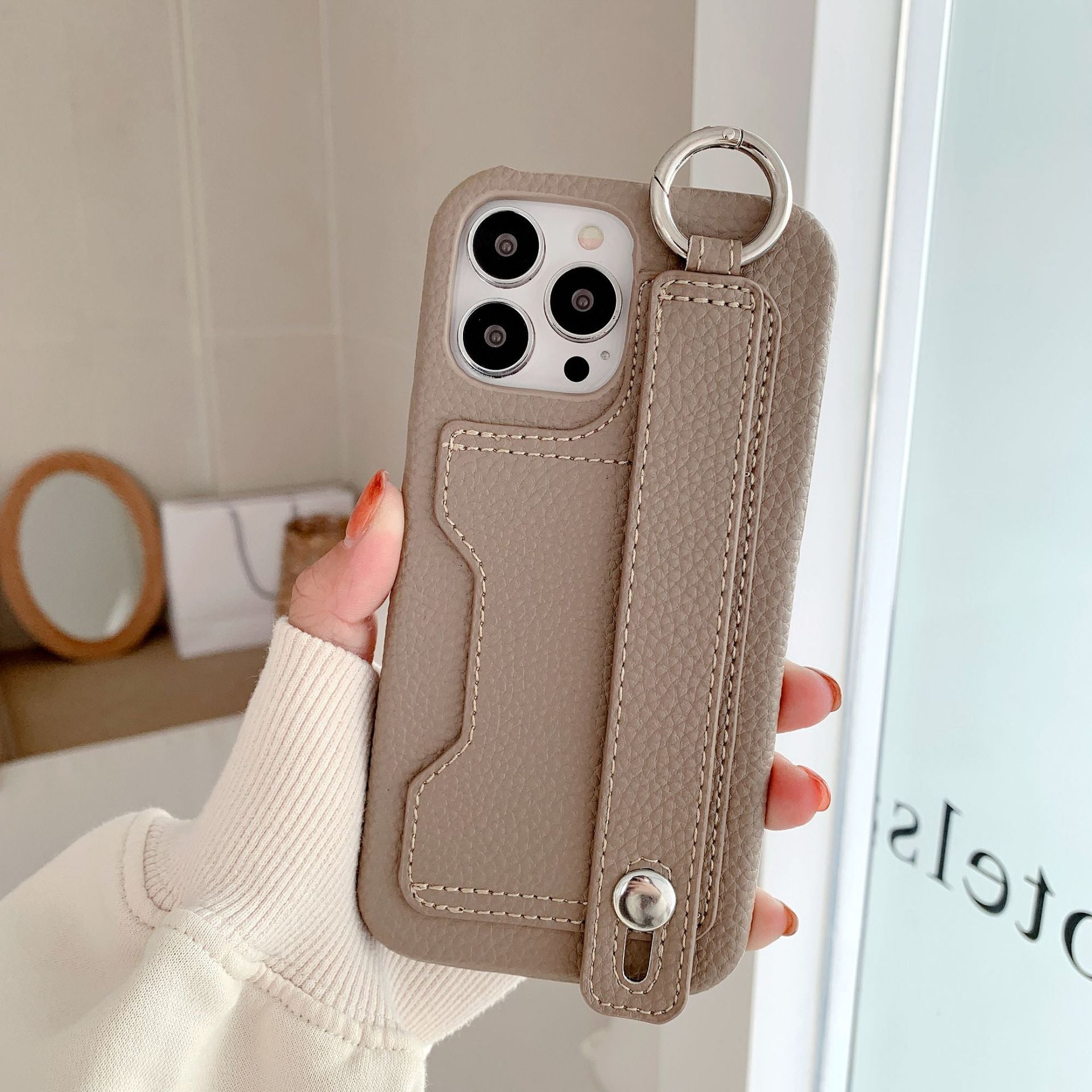 Leather phone case suitable for iPhone, with card slot and wrist strap protection